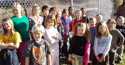 Kids planting Arbor Day tree at LES